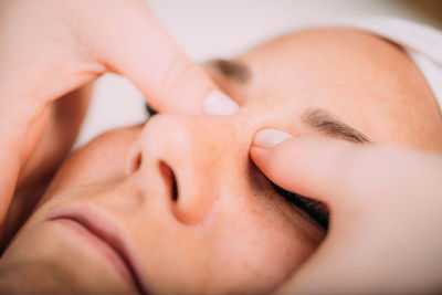 Face lifting massage, beautiful woman getting face lifting massage in a beauty salon.