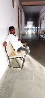 Man sitting on chair in building