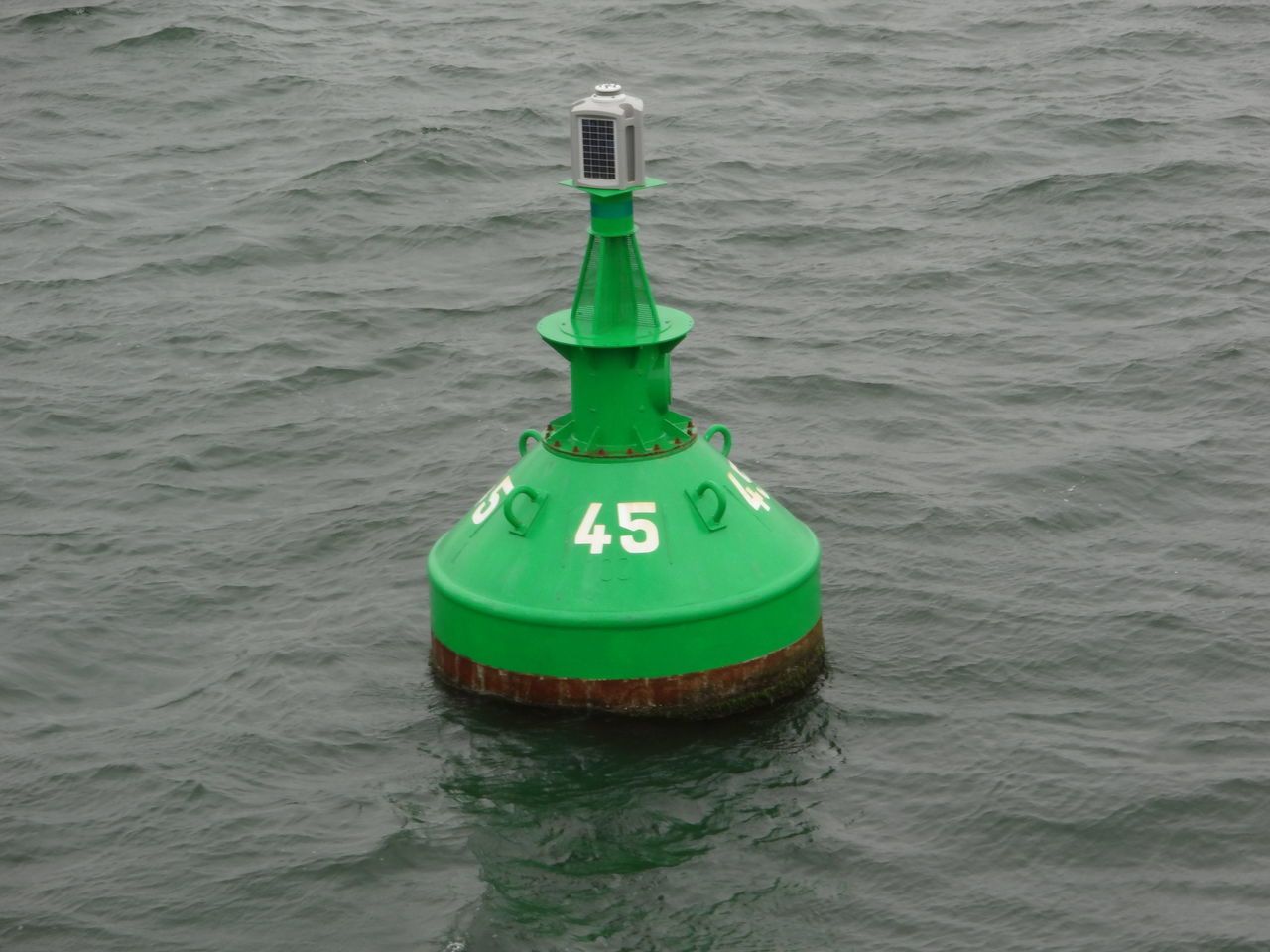 CLOSE-UP OF LIGHTHOUSE ON SEA