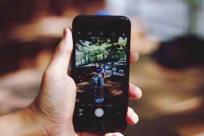 Close-up of hand holding smart phone