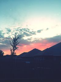 Scenic view of landscape against sky at sunset