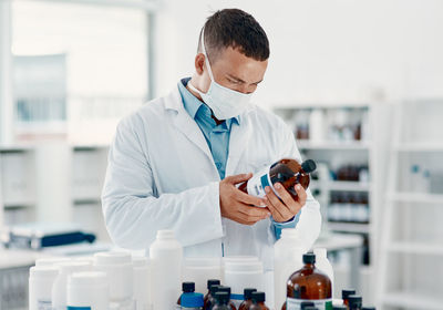 Doctor examining chemical in laboratory