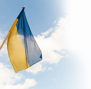 Low angle view of flag against sky