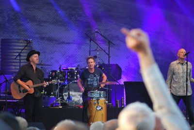 Full length of men playing at music concert