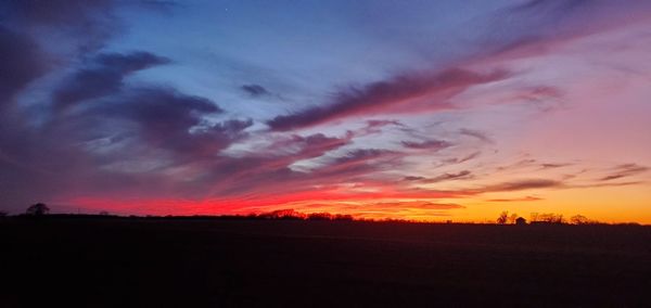 Scenic view of dramatic sky during sunset