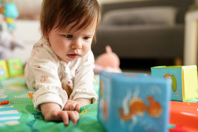 Baby girl playing at home