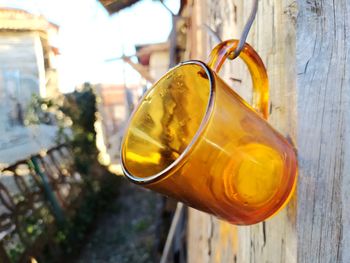 Glass cup hanging on wooden boards