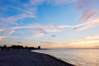Scenic view of beach against sky during sunset