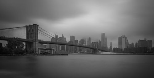 Suspension bridge over river in city