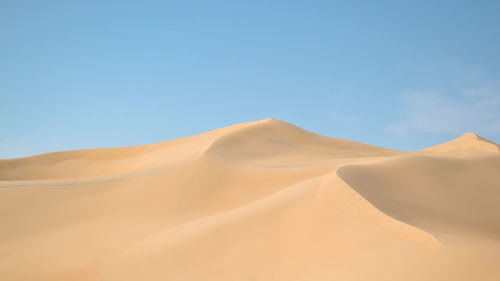 Scenic view of desert against clear sky