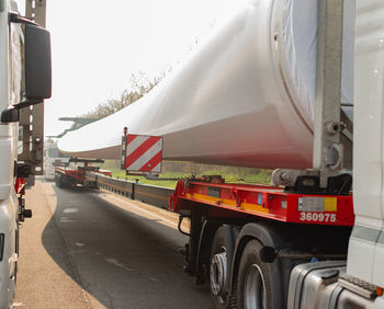 Vehicles on road against the sky