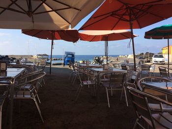 Empty chairs and tables at restaurant