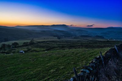 Scenic view of landscape against sky during sunset
