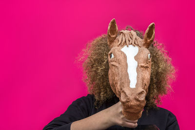 Close-up of teenage girl wearing animal mask