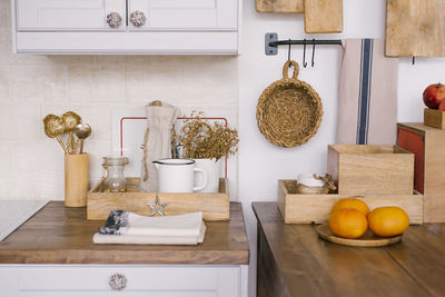 The white modern scandinavian-style kitchen is decorated with a christmas background.