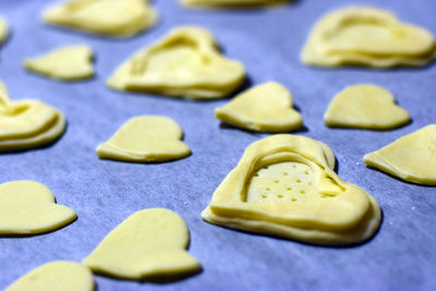 Close-up of heart shape cookies on baking sheet