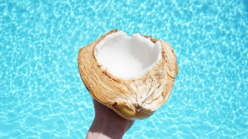 Close-up of hand holding ice cream