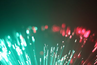 Close-up of illuminated lights against black background