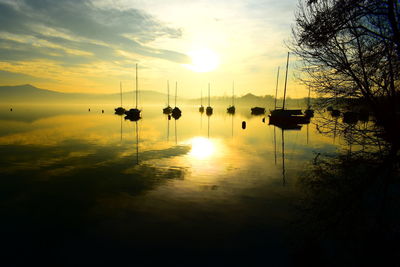 Scenic view of lake against sky during sunset