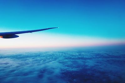 Cropped image of airplane on landscape