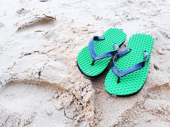 High angle view of shoes on sand