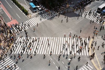 High angle view of people crossing road