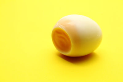 Close-up of apple against yellow background