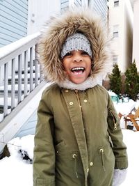 Smiling boy wearing warm clothing during winter