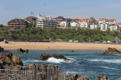 View of beach with town in background