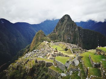 Machu picchu with mountain range in background