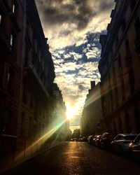 Low angle view of street against sky during sunset