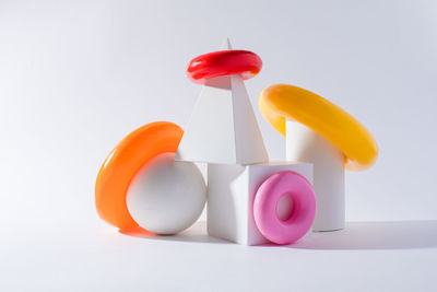 Close-up of multi colored candies against white background