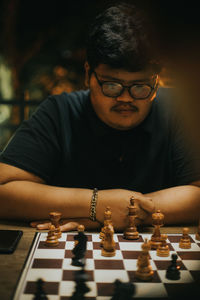 Full length of man playing with stuffed toy