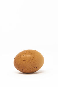 Close-up of bread against white background