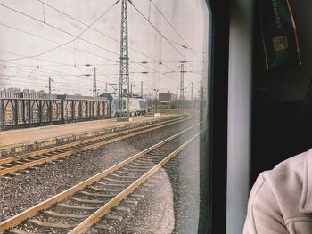 Train at railroad station against sky