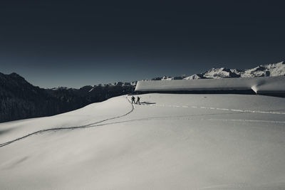 Snow covered mountain against sky