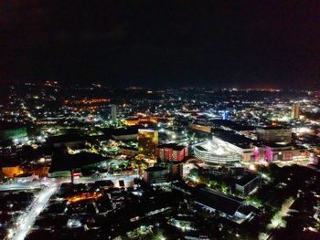 High angle view of city buildings at night
