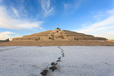 View of historic building against sky during winter