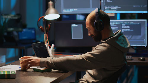 Midsection of man working in office