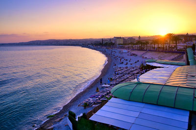 Scenic view of beach against sky during sunset