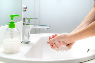 Midsection of woman in bathroom