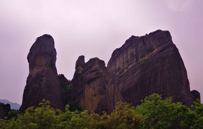 Low angle view of rock formations against sky