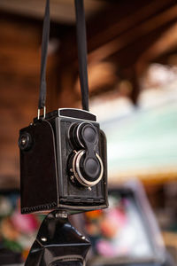 Close-up of old camera hanging