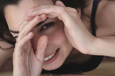 Close-up portrait of young woman hands