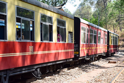 Kalka shimla toy train moving on mountain slopes, beautiful view, one side mountain, one side valley