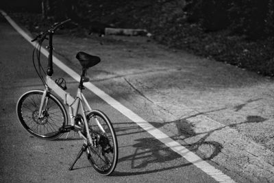 High angle view of bicycle on footpath