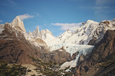 Panoramic view of snowcapped mountains against sky