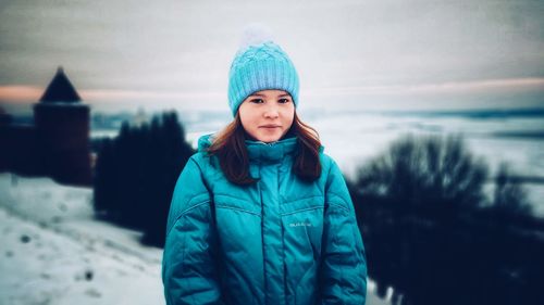 Portrait of teenage girl standing during winter