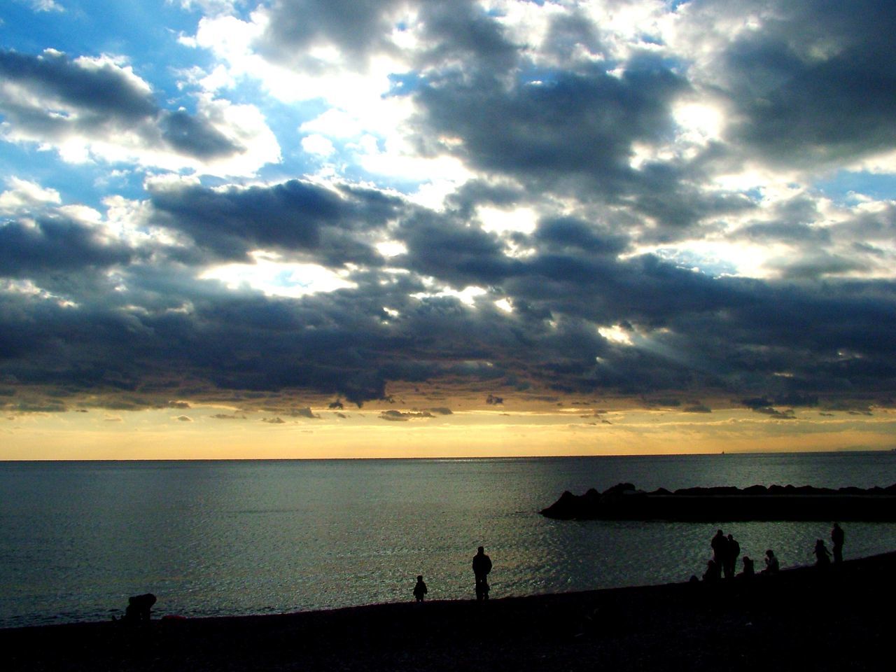 sea, sky, water, silhouette, horizon over water, cloud - sky, beach, scenics, sunset, beauty in nature, tranquil scene, tranquility, nature, cloudy, shore, cloud, idyllic, leisure activity, lifestyles