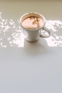 High angle view of coffee cup on table